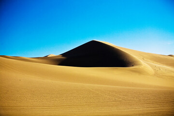 Fototapeta na wymiar Sand dunes in a desert, Huacachina, Ica, Ica Region, Peru