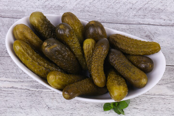 Pickled cucumbers heap in the bowl