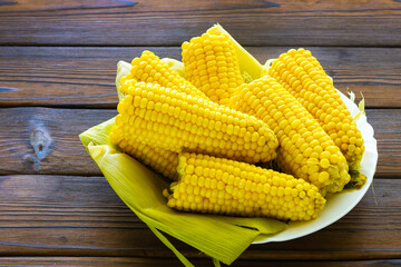 Cooked corn on the cob on a plate