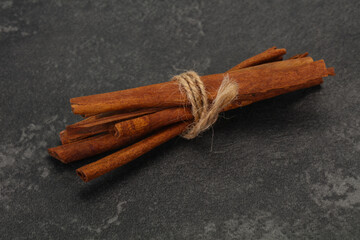 Aroma cinnamon sticks over dark