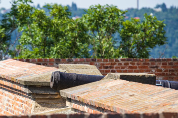 Demonstration of a historic cannon that is on the walls.