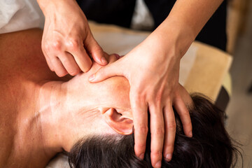 Fototapeta na wymiar Professional facial massage to tighten and elasticize the skin