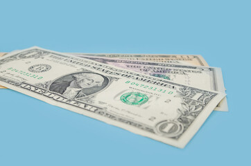 one US dollar bills on a blue background.