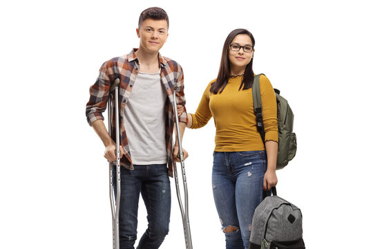 Male Student With Crutches And A Female Student Helping Him