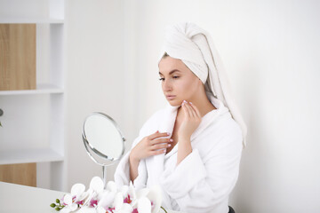 Obraz na płótnie Canvas woman doing morning skin care after shower.