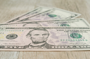 close-up of 5 dollar bills. Financial background