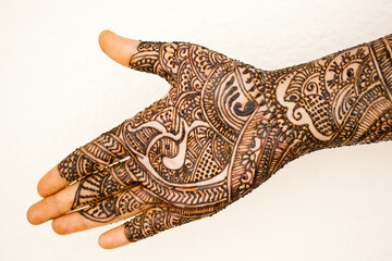 Beautiful artwork drawn on the hand with Mehndi.