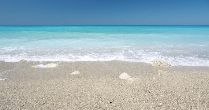 Kathisma Beach, Lefkada Island, Greece. Beautiful waves and blue sea. Summer vacation concept