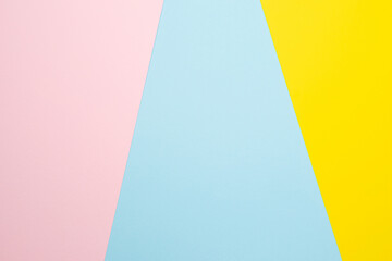 Texture paper yellow, pink and blue. Background image. Minimalism, flat lay, place for text.