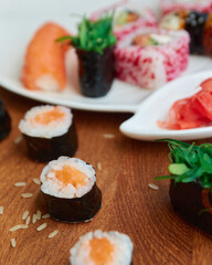 Sushi rolls. Japanese food in the restaurant. Sushi roll with salmon, vegetables close-up