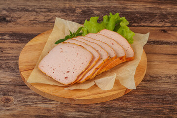 Boiled pork sausage over board