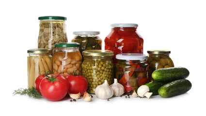 Glass jars with different pickled vegetables and mushrooms on white background