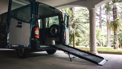 Accessible vehicle with ramp for disabled people on wheelchair.