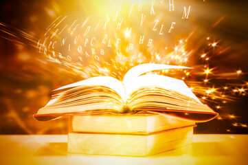 Open book on the table and english alphabet floating above the book in the library and blurred bookshelf background. education background. back to school concept.