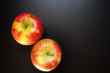 Apples on black table, food background
