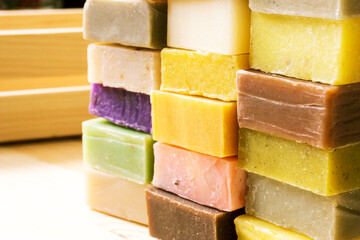 Variety of natural handmade soap bars. Selective focus, shallow depth of field.