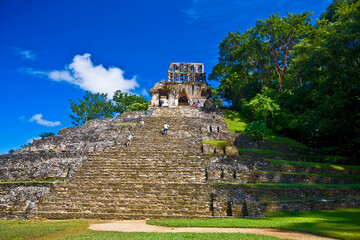 Tourists at old ruins of a temple, Templo De La Cruz, Palenque, Chiapas, Mexico
