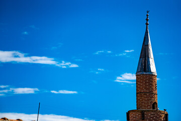 mosque minaret on blue sky background