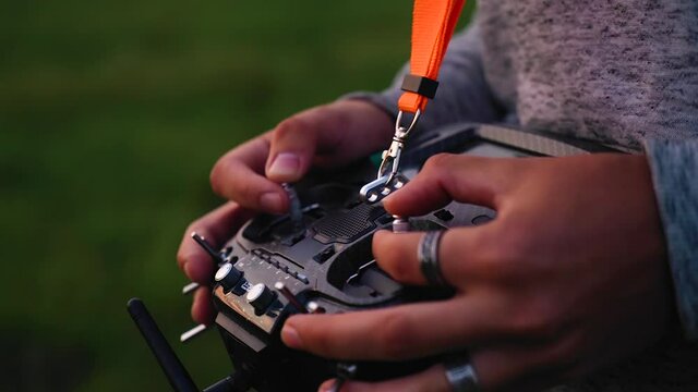 Close-up of a guy's hands with a drone control panel