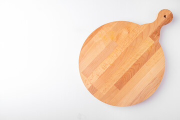 Empty round pizza board isolated on a white. Top view