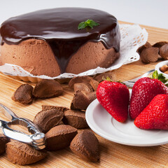 Chocolate cake and strawberries with brazil nuts