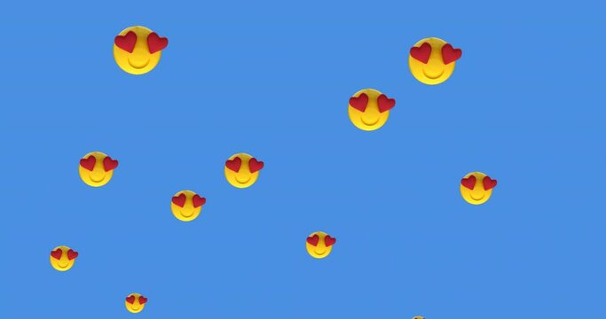 Multiple heart eyes face emoji moving against blue background