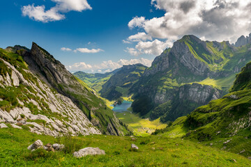 Fototapeta na wymiar View from above of the Seealpsee, surrounded by the Swiss Alps. Canton of Appenzell, Switzerland.