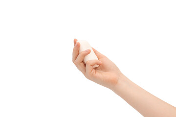 A bar of soap in female hands on a white background.