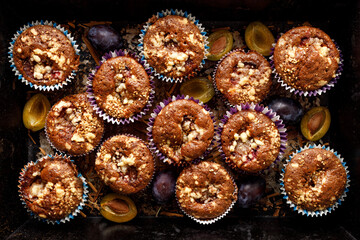 Homemade cinnamon and plum muffins, top view