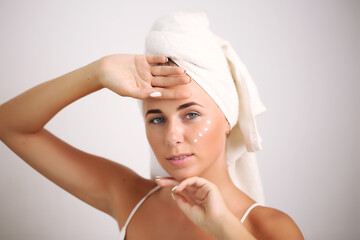 skin care and recovery.young girl with clean perfect skin. Blonde with natural touching her face. Spa