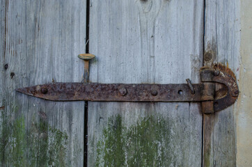 the old wrought-iron hinges on the doors of the old garage