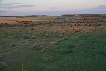 Fototapeta premium Sunset over fields in the countryside