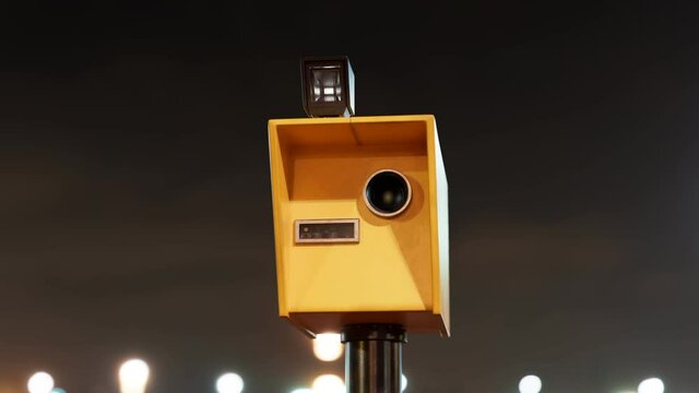 Speed camera takes photos with the flash at night. Speed control at the road.