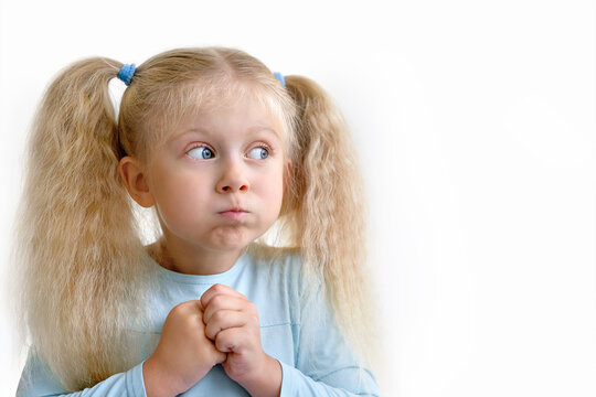 Little girl puffed out her cheecks
