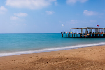 Turkey, Belek. Pier in Mediterranean Sea with long exposure and a blurred background. August 2020