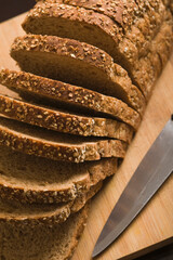 Close-up of bread slices with knife