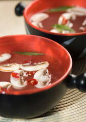 Close-up of bowls of Oriental mushroom soup