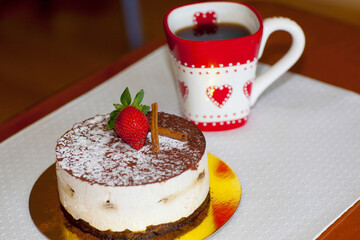 High angle view of a chocolate mousse pastry with a cup of coffee