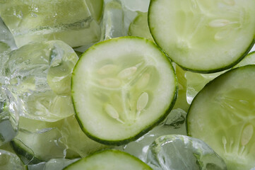 Close-up of cucumber slices on ice cubes