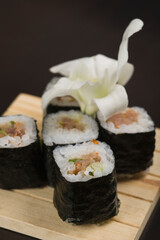 Close-up of futomaki sushi on a cutting board