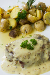 High angle view of steak served with potatoes