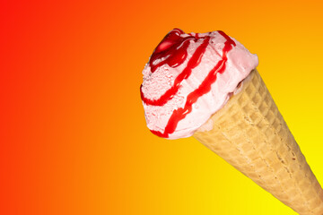 Ice cream cone with strawberry syrup cut out and placed on a yellow and red gradient background.