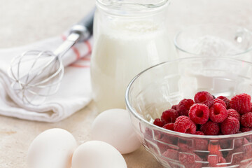 ingredients for making raspberry mousse on a white table, recipe, diet food. top view