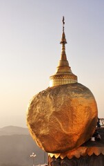 Kyaiktiyo pagoda or Golden rock pagoda at sunset, Buddhist pilgrimage site, Myanmar