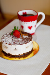 High angle view of a chocolate mousse pastry with a cup of coffee