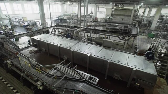 Beer factory interior with a lot of machines in work