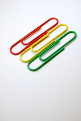 Close-up of three paper clips in a row