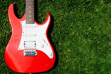 Close-up of an electric guitar on the grass