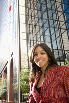 Indian businesswoman in front of high-rise