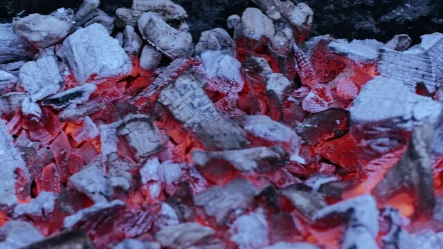 Red-hot charcoal gives off intense heat. High combustion temperature of charcoal.